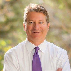 Dr. Caridi consulting with a gynecomastia patient in his Austin office