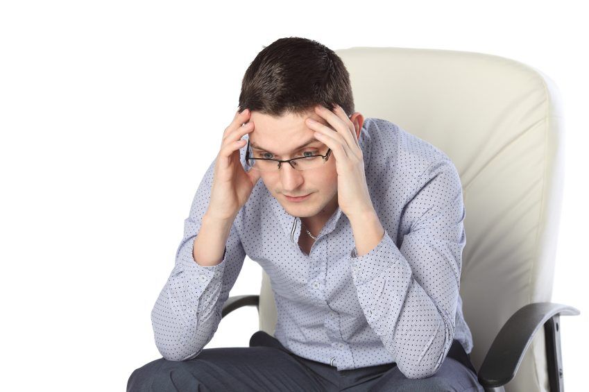 Troubled man in a chair